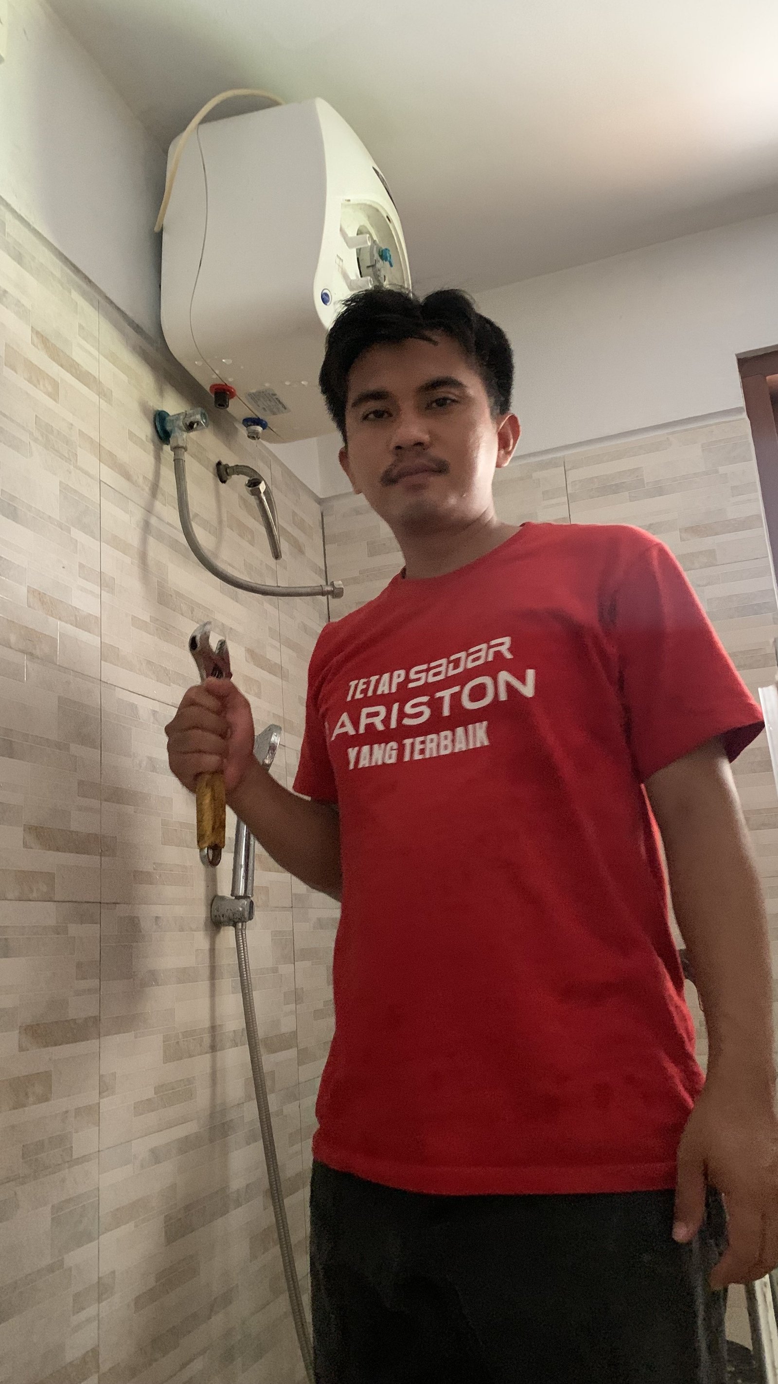 Technician Servicing Water Heater